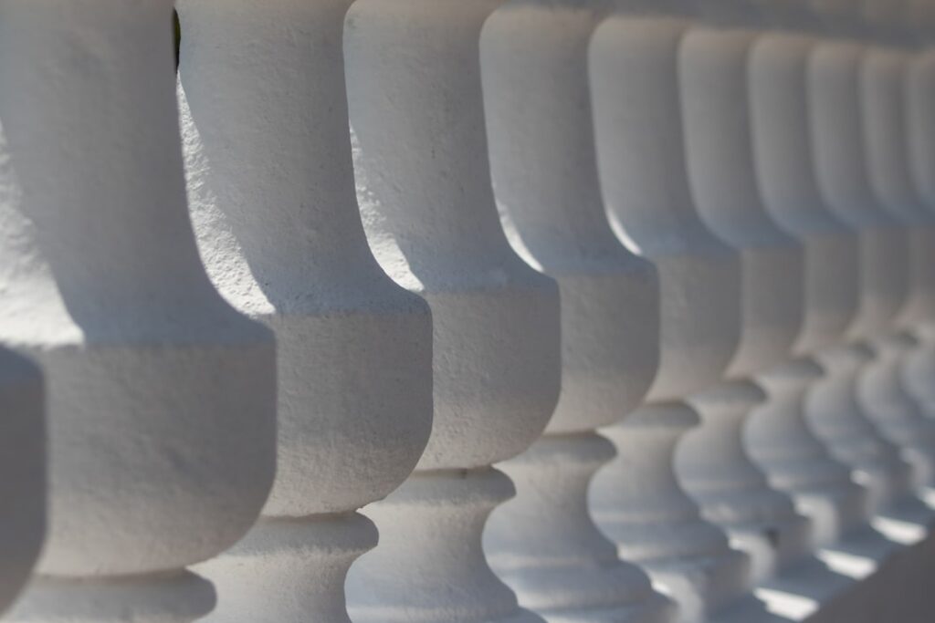 Close-up of spray foam insulation being applied to a wall cavity.